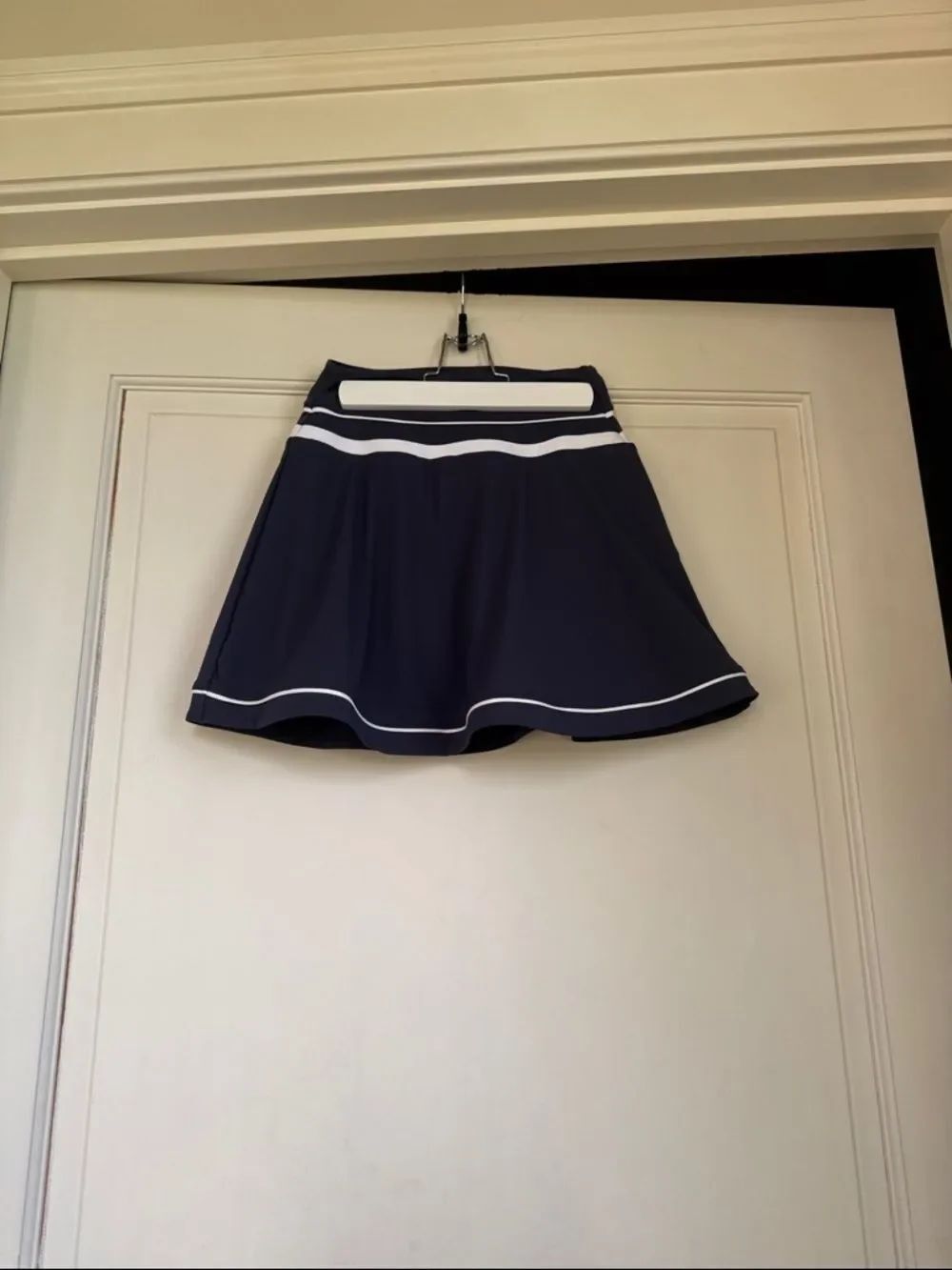 New Without Tag Navy tennis Skirt, White Trim, built-in shorts two pockets